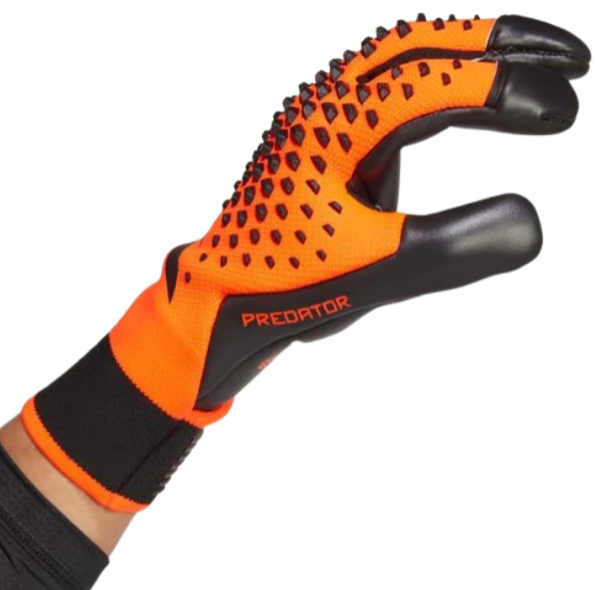 Orange and black soccer glove with 'Predator' branding on a white background