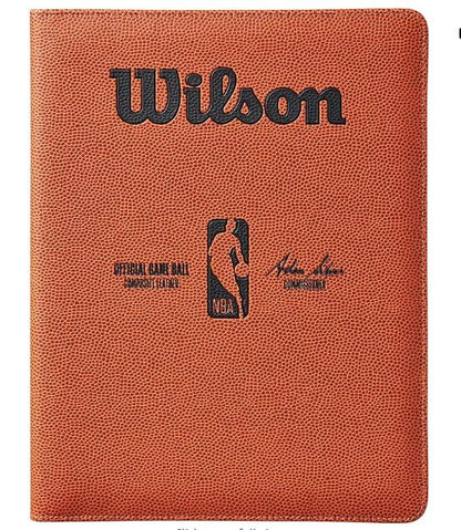 Basketball with Wilson branding and NBA logo on a brown background