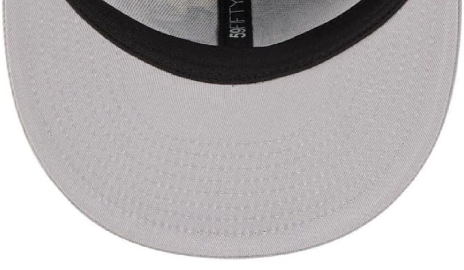 Close-up of a white cap with black mesh and brand logo on a white background