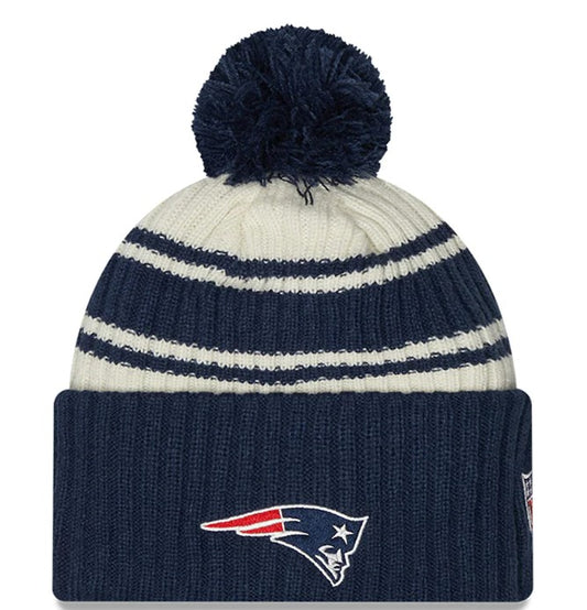 New Era Cream/Navy New England Patriots 2022 Sideline Sport Cuffed Pom Knit Hat